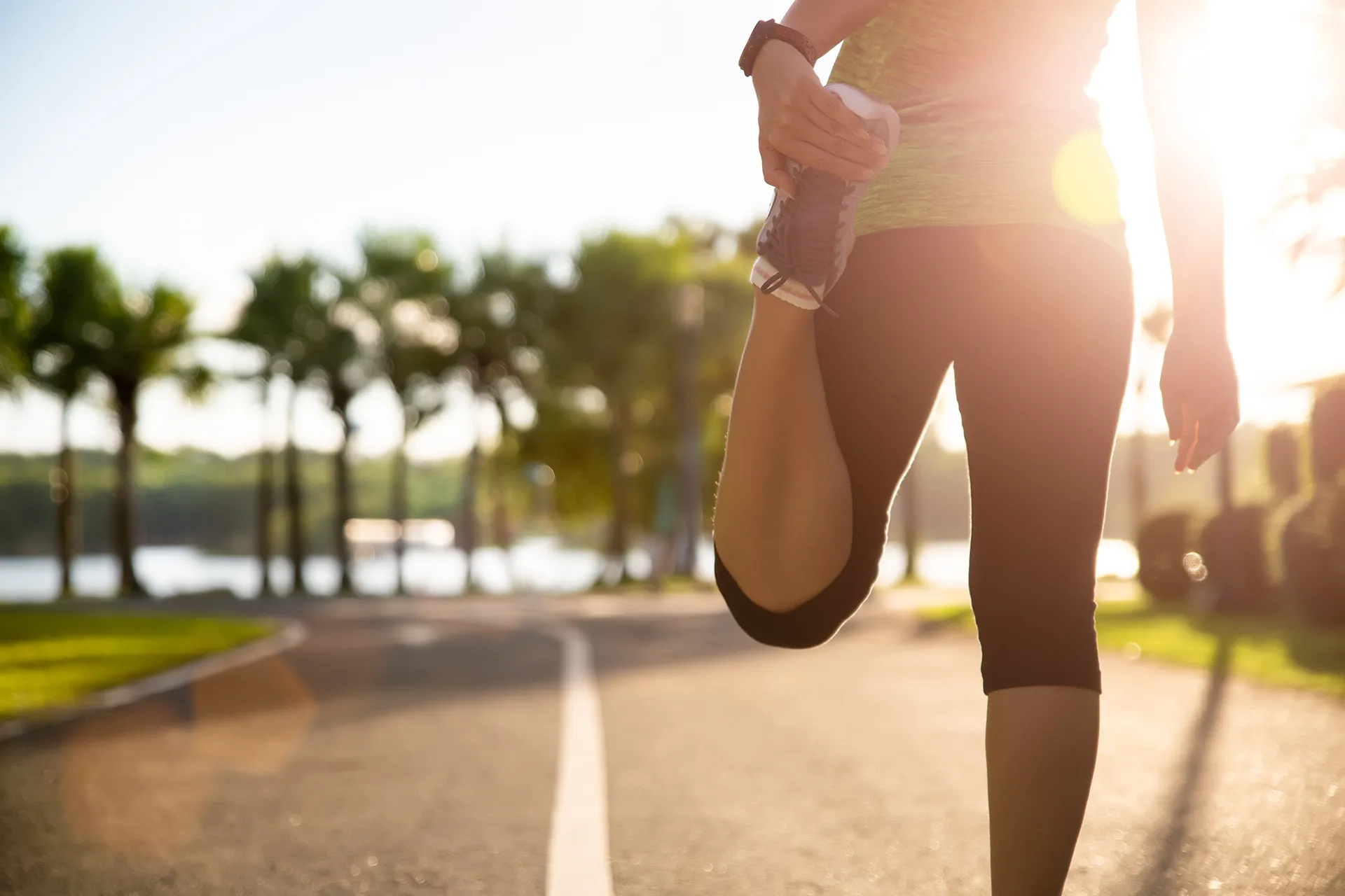 Woman Runner Stretching Legs Before Run Park Outdoor Exercise Concept